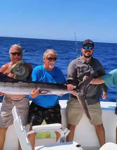 Family enjoying a sunny day on a Boats Baja fishing charter.
